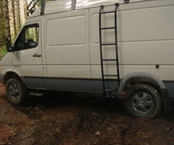 A Van is turning around in the forest 