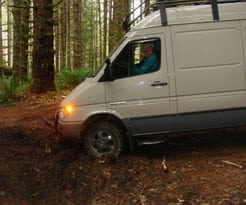 A Van is turning around in the forest - side 2